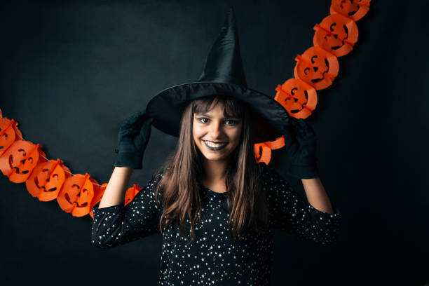 istock Portrait of a happy young witch in studio 1173581054