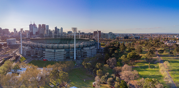 Australia, Melbourne - September 21, 2018: Aerial shot of the Melbourne Cricket Ground with Melbourne city skyline behind