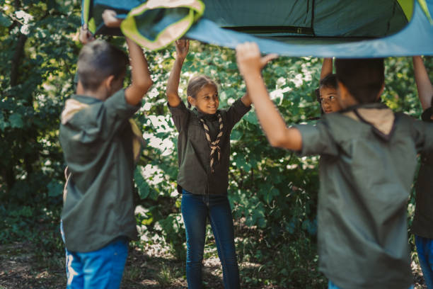 istock Group Of Scouts Building A Tent 1173582692