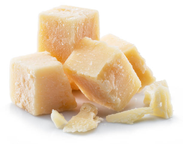 istock Parmesan cheese cubes isolated on white background. 1173584058