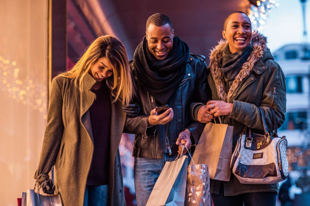 istock Three Beautiful Black friends at Christmas Shopping 1173584961