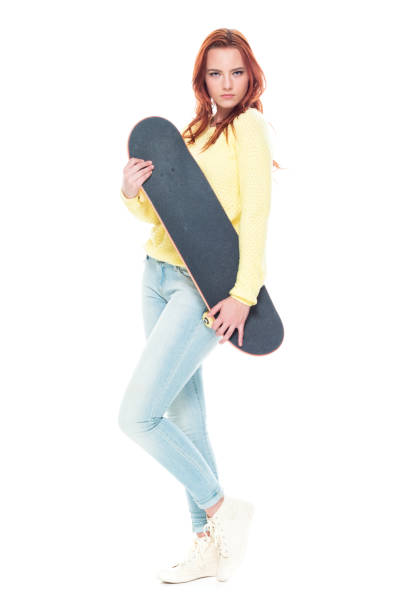 istock Cute female holding a skateboard 1173585922