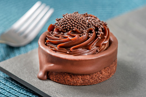 Mini chocolate pie on slate background