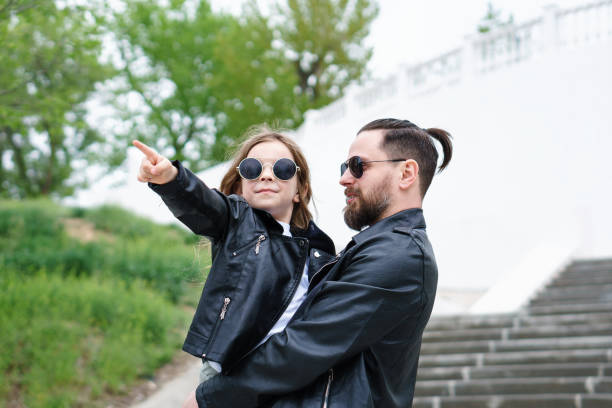 istock Dad and daughter walk around the city 1173587227