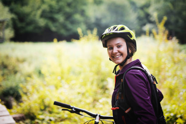 istock Woman riding bicycle in nature 1173587259