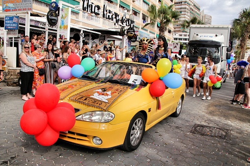 Benidorm, Alicante, Spain- September 7, 2019: Gay People with funny costumes dancing and having a good time in the Gay Pride Parade in Benidorm in September