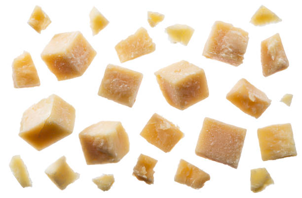 istock Parmesan cheese cubes and parmesan crumbs on white background. Clipping path. 1173588004