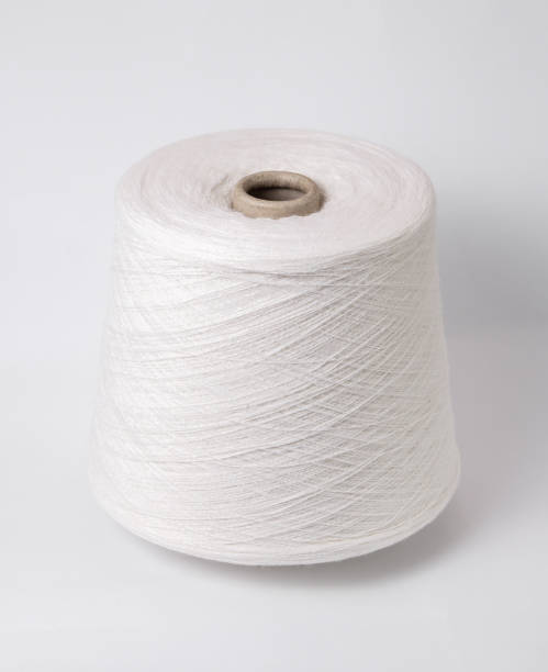 istock bobbin of yarn on a white background. Side view.Textile reel on isolated white background. 1173589278
