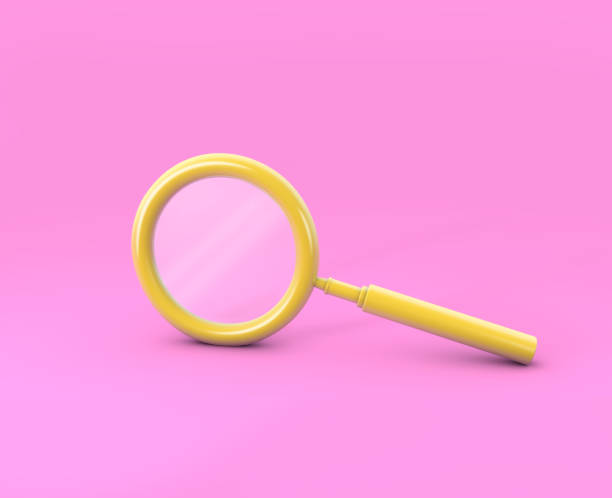 istock Yellow magnifying glass minimal pink background 1173590598