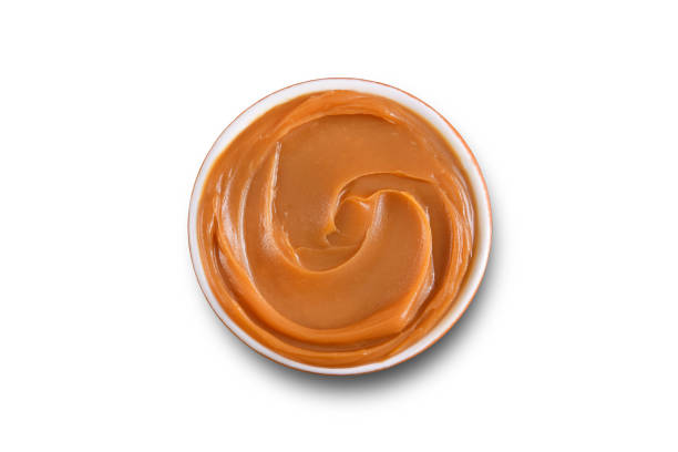 milk caramel Dulce de Leche bowl isolated on white background jar of milk stock pictures, royalty-free photos & images