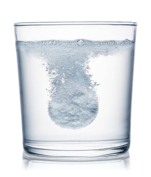 istock Effervescent tablet dissolving in a glass of water. Clipping path. 1173591880