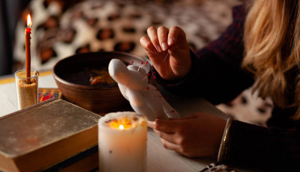 istock Voodoo doll in hands of witch, ritual. Psychic vision, fortune teller 1173592913