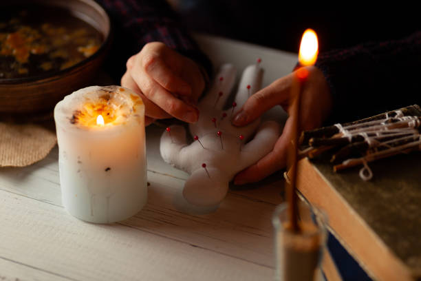 istock Voodoo doll in hands of witch, ritual. Psychic vision, fortune teller 1173592914
