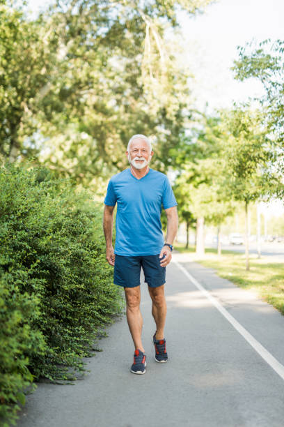 istock Sporty senior man walking outdoors. 1173597921