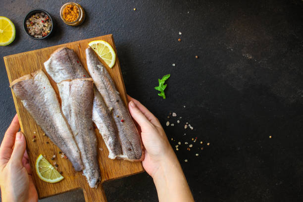 istock fish raw hake (set of ingredients for cooking). food background. top view. copy space 1173597990