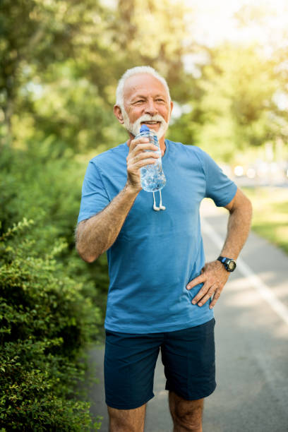 istock Senior sportsman taking a break from running. 1173598154