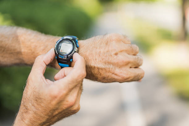 istock Senior man using a sport watch close up. 1173598173