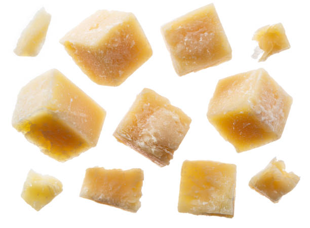 istock Parmesan cheese cubes and parmesan crumbs on white background. Clipping path. 1173598985