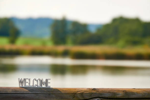 istock Welcome sign on outdoor river background at sunset 1173599645