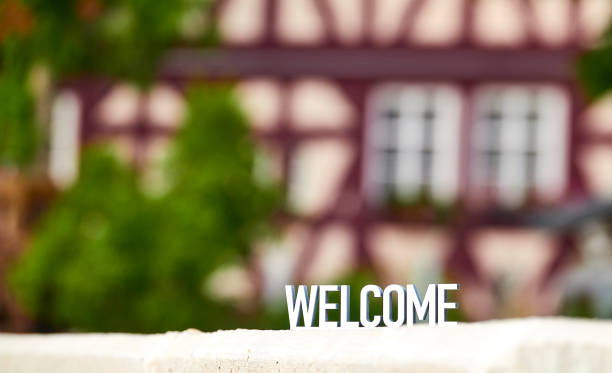 istock Welcome sign on half timbered house background 1173599721