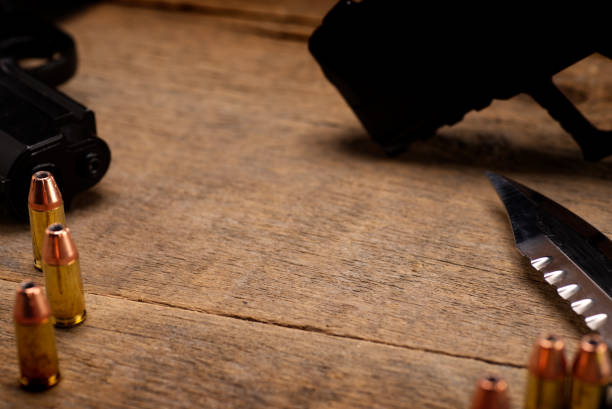 istock Handgun Bullets on Wooden background 1173599841