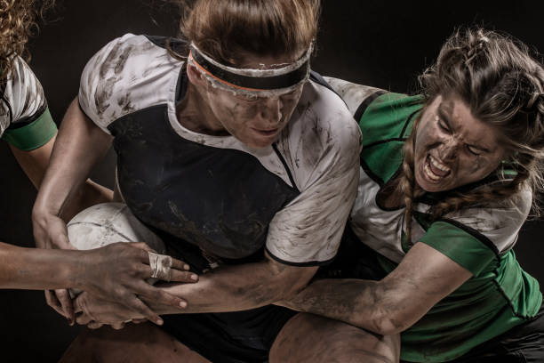 istock Three Dirty Female Rugby Players 1173600998