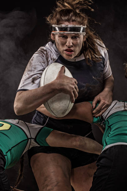 istock Three Dirty Female Rugby Players 1173601182