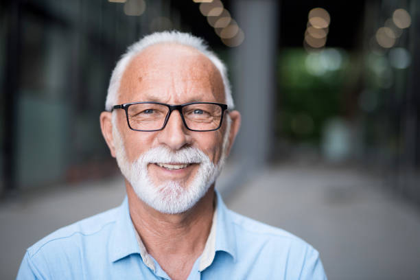 Portrait of happy senior businessman. Portrait of happy senior businessman. 60 64 years stock pictures, royalty-free photos & images