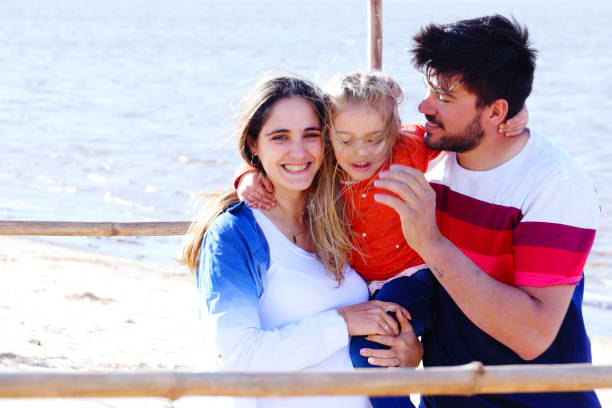 istock parents with daughter playing the arena 1173603929