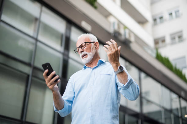 istock Displeased senior man using a phone. 1173603970