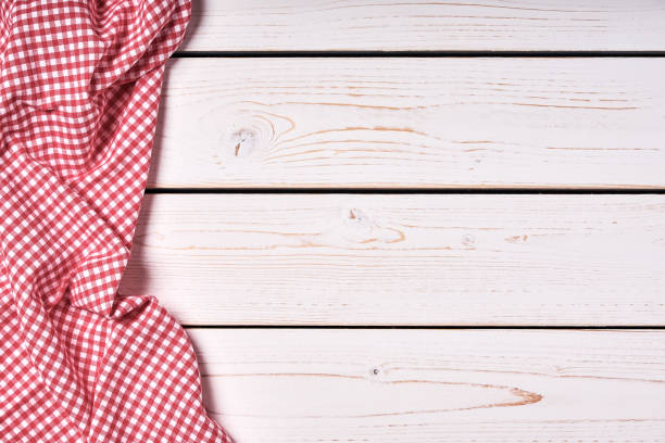istock Background from white wooden boards with red cloth and space for text. 1173604287