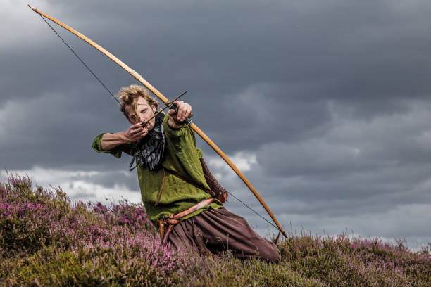 An individual viking warrior archer outdoors An individual viking warrior archer man on highland moors during a battle warrior person photos stock pictures, royalty-free photos & images
