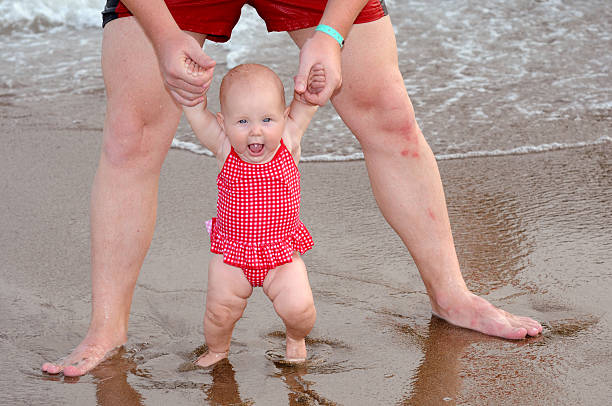 Baby on the beach stock photo