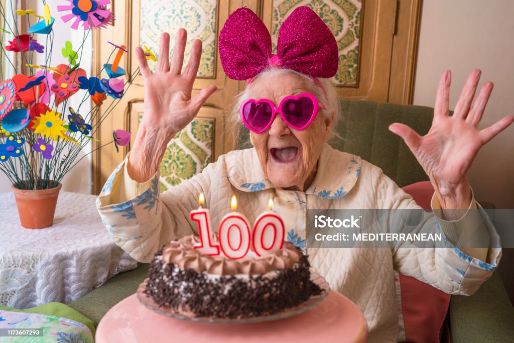100 years old birthday cake to old woman 100 years old birthday cake to old woman elderly celebration funny humor Birthday Stock Photo