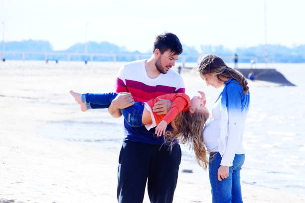 istock parents with daughter playing the arena 1173607673