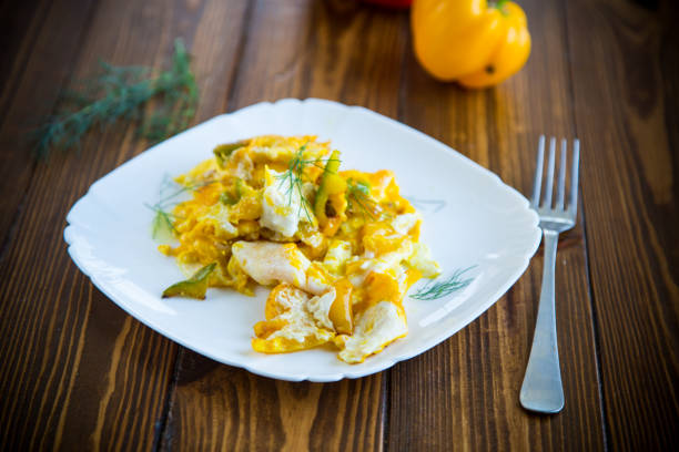 istock fried omelet from homemade eggs with sweet yellow pepper in a plate 1173607713