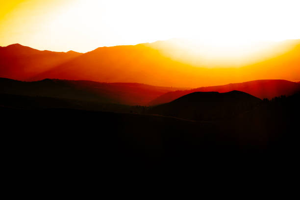 Sunrise or sunset on mountains mountain range and sky