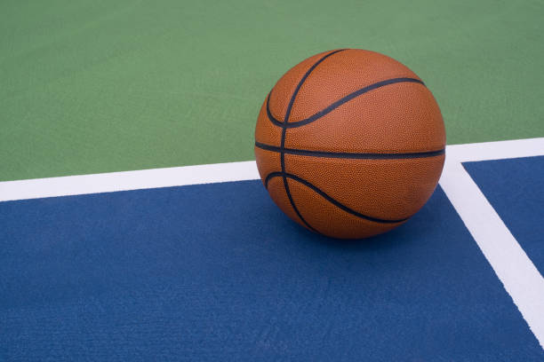 Basketball rests on court