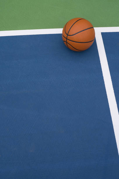 istock Basketball rests on court 1173611169