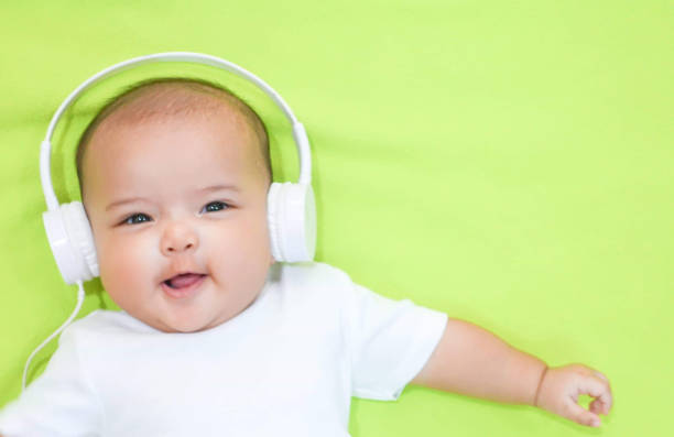 Asian Baby Girl Wears White Headphone And White Shirt On Pink Background  Stock Photo - Download Image Now - iStock