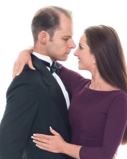istock Beautiful couple dancing together while wearing formal wear 1173612185