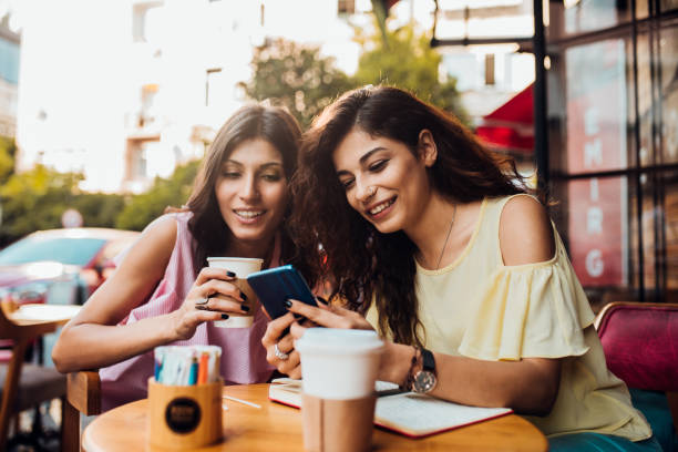 istock Middle Eastern girls looking at a phone 1173612986