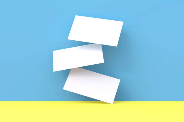istock Falling realistic blank white business cards template at blue and yellow background. 3D Render Illustration of realistic mockup design. 1173614326