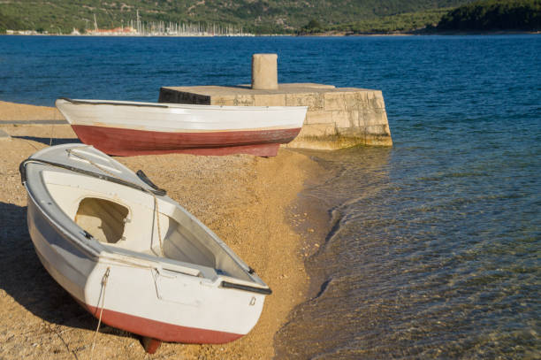 istock Two boats at a small beach on Cres, Croatia 1173615052