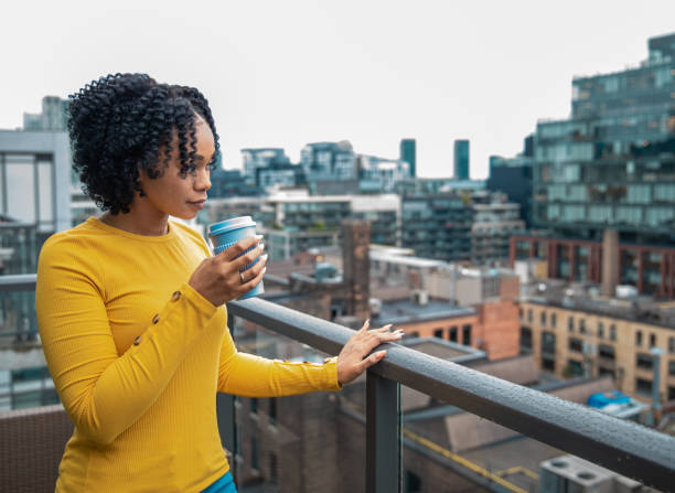 istock Woman Holding a Reusable Cup 1173616321