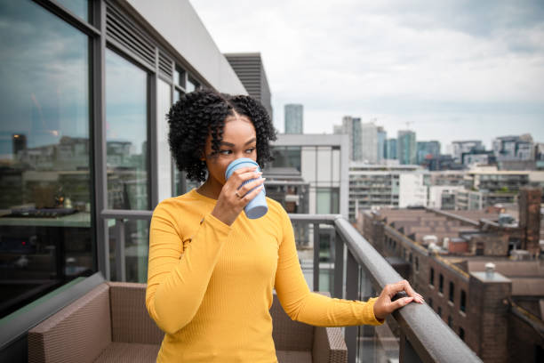 istock Woman Holding a Reusable Cup 1173616323