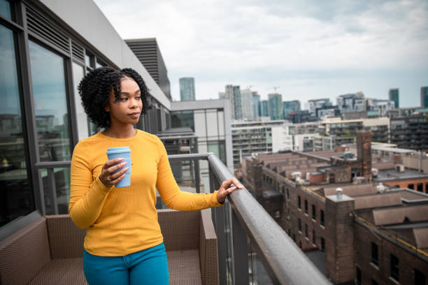 istock Woman Holding a Reusable Cup 1173616324