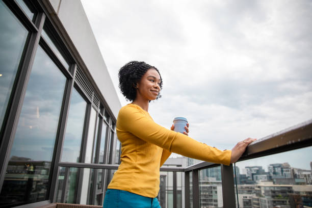 istock Woman Holding a Reusable Cup 1173616327
