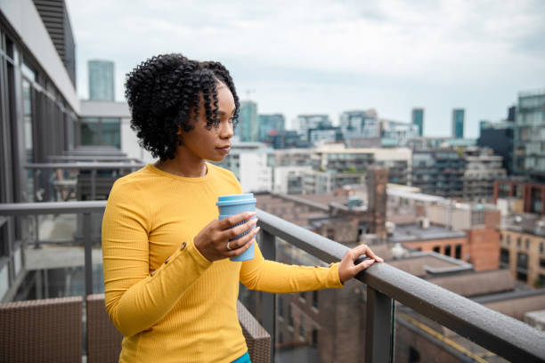 istock Woman Holding a Reusable Cup 1173616329