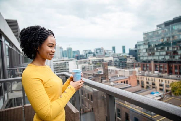 istock Woman Holding a Reusable Cup 1173616336